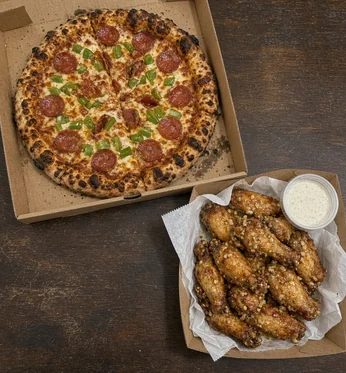 Pepperoni and green pepper pizza with honey garlic wings and garlic dip